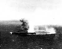 Photo # 80-G-17031:  Japanese aircraft carrier Shokaku under attack by USS Yorktown aircraft, 8 May 1942