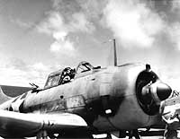 Photo # 80-G-312000:  SBD-3 scout bomber warming up on USS Yorktown on the morning of 4 June 1942, during the Battle of Midway.