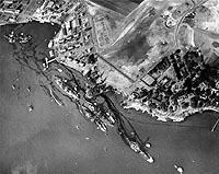 Photo # 80-G-387565: Aerial view of 'Battleship Row' on 10 December 1941, showing damage from the 7 December Japanese raid.