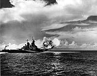 Photo #  80-G-47015: USS Missouri firing a salvo from her forward sixteen-inch gun turrets, circa August 1944.