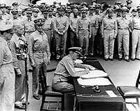 Photo # 80-G-701293: Fleet Admiral Chester W. Nimitz signs the instrument of Japan's surrender, 2 September 1945