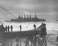 Photo # NH 46149:  Crewmen are brought ashore by breeches buoy from the stranded USS Milwaukee, 13 January 1917