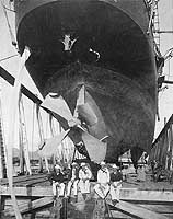 Photo # NH 63083:  USS Nipsic in the floating drydock at Honolulu, Hawaii, circa August 1889