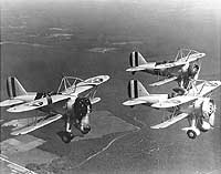 Photo # NH 71617: F9C-2 aircraft from USS Macon flying in formation, circa 1933-35