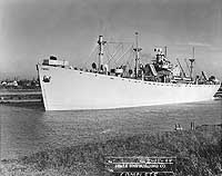 Photo # NH 75821:  SS Norman O. Pedrick leaving her builder's yard, 15 February 1944. The next day she became USS Stag (IX-128, later AW-1)