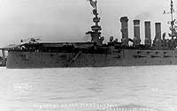 Photo # NH 77574:  Eugene Ely lands his Curtiss pusher biplane on board USS Pennsylvania, 18 January 1911.  Photographed by Weidner.