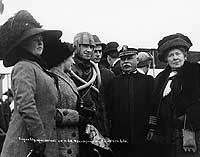 Photo # NH 77580:  Eugene Ely with USS Pennsylvania's Commanding Officer and others, 18 January 1911.  Photographed by R.J. Waters & Co.