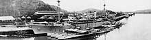 Photo # NH 96623:  USS Holland in Balboa Harbor, Panama Canal Zone, with seven 'S'-type submarines alongside, 7 May 1927.  Photographed National Photo Service