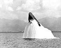 Photo # NH 97019:  USS Pickerel surfacing at a 48 degree up angle, off Oahu, Hawaii, 1 March 1952.