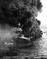 Photo # NH 97400: Crew abandoning the damaged USS California as burning oil drifts down on the ship, shortly after the Japanese raid on Pearl Harbor ended, 7 December 1941.