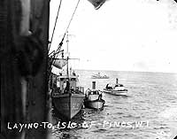 Photo # NH 99718:  USS SC-353 alongside USS Hannibal, off Cuba during the 1920s