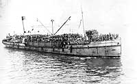 Photo # NH 103639:  Lighter Rin Tin Tin bringing troops out to a transport for passage home from France, circa mid-1919