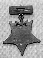 Photo # NH 105355:  Medal of Honor awarded to Ordinary Seaman John Andrews, USN