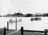 Photo # NH 105452: Boats from USS Buffalo laying a submarine cable at Sitka, Alaska, circa October 1914.