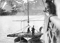 Photo # NH 105458: USS Buffalo handling its cargo pontoon at Dutch Harbor, Alaska, in May or June 1914.