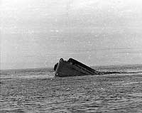 Photo # NH 106011:  USS Yorktown sinking rapidly by the stern, 7 June 1942