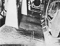 Photo 16-2: HALIBUT (SS232). View showing deformation which occurred to MBT No. 1 tank top flat in forward torpedo room of HALIBUT (SS232) as a result of her action of 14 November 1944