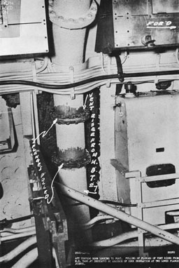 Photo 20-1: Tunny (SS282). View showing damage which occurred to port vent riser of MBT No. 7 in after torpedo room of Tunny as a result of her action of 1 September 1944